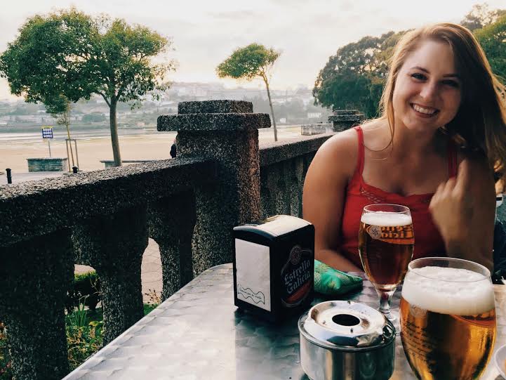 This is my happiest smile while drinking beer on the beach at my go-to bar. I swear I'm not flipping you off.
