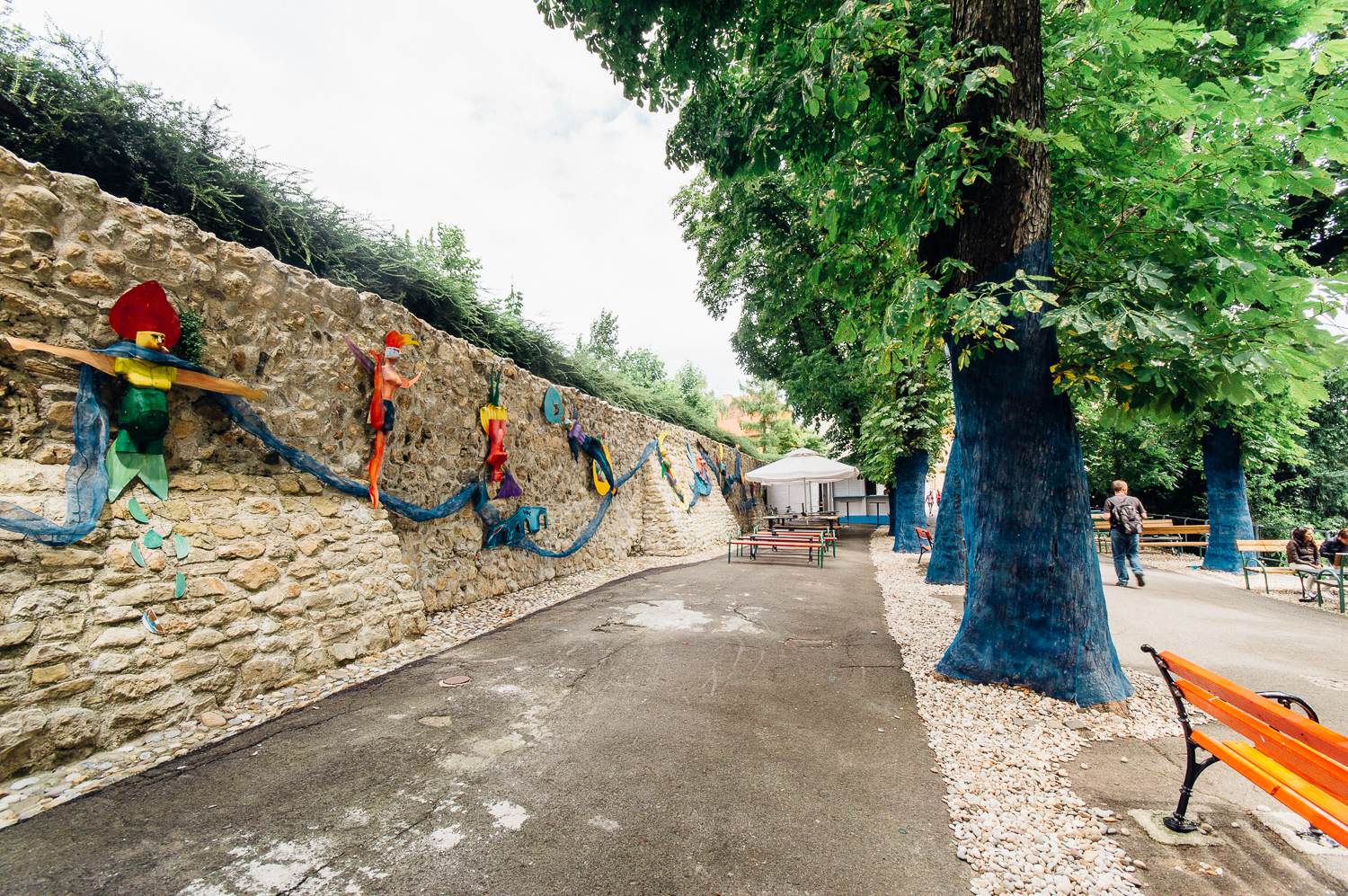 Colorful trees, benches, and walls. They also had sound installations near tables that played ocean waves.