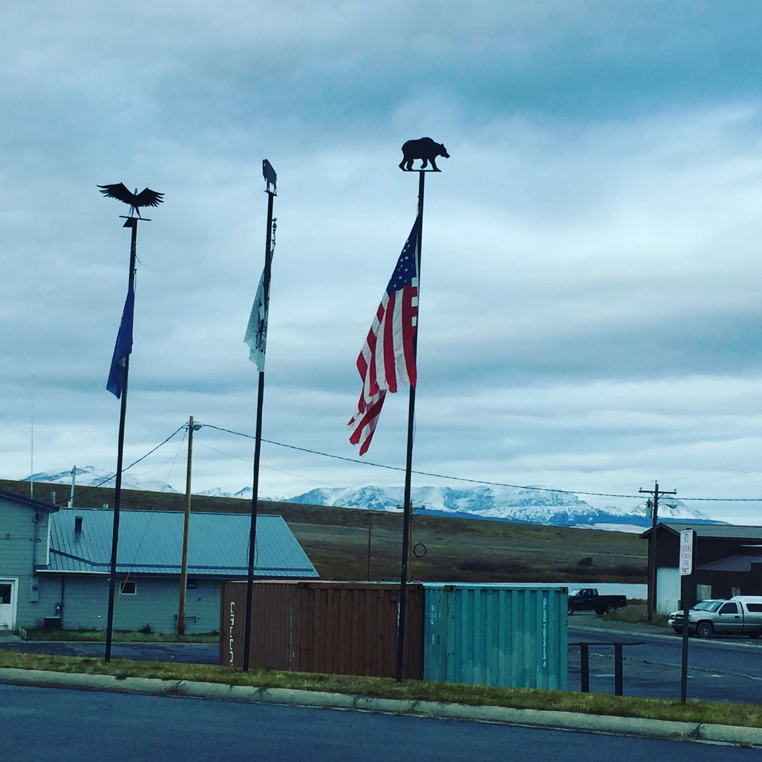 The federal, state, and tribal flags represented on the Blackfeet reservation