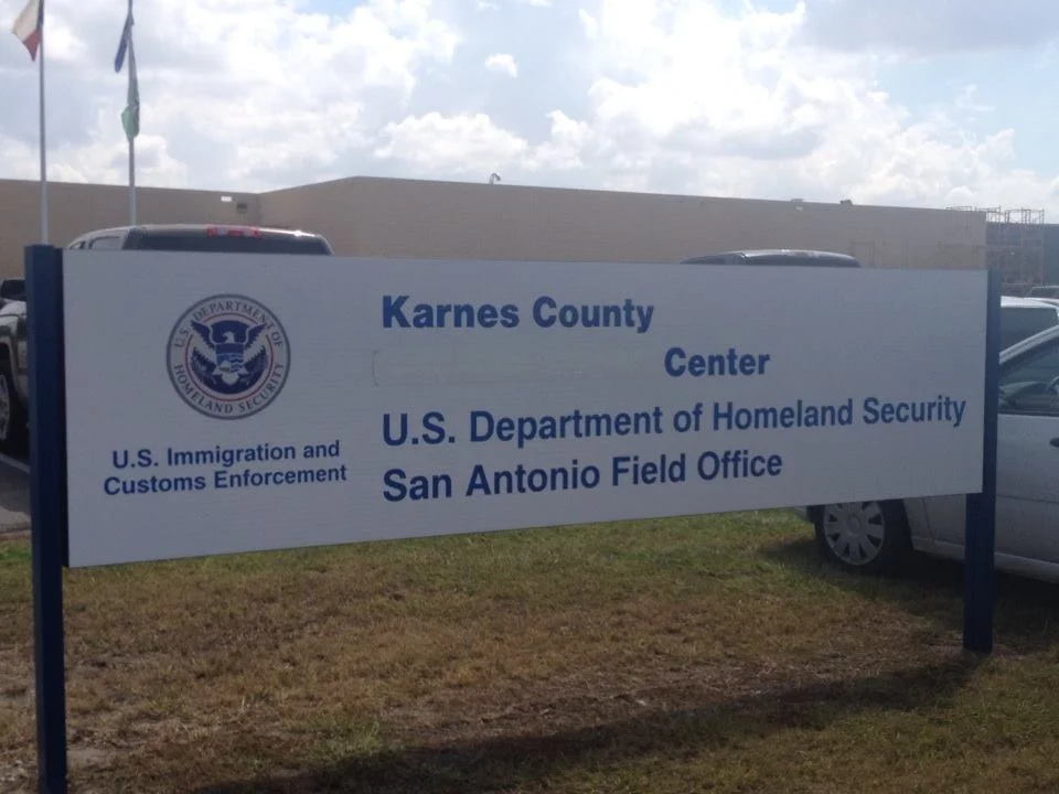 Outside Karnes Family Detention Center in Karnes City, Texas—the words "Civil Detention" have been covered up.