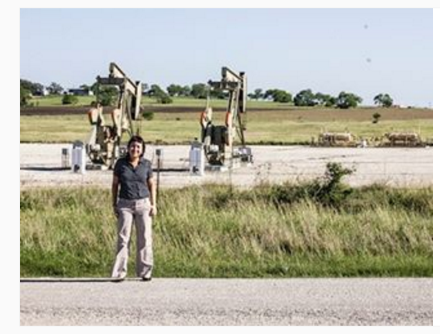 Stop #10: RAICES/Detention Center in Karnes City, Texas -- outside the detention center facility, there is nothing but oil rigs and flat Texas prairie.