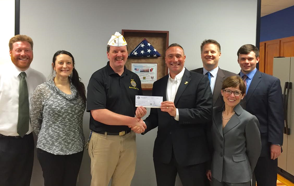 Capitol Services staff pictured with Mark Sutton, Public Relations Director at the American Legion Department of Michigan. Capitol Services awarded the Michigan American Legion Foundation a gift in support of the Heroes to Hometowns program.