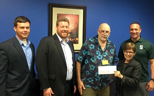 Members of the Capitol Services, Inc. team with Michael Hood, Crossing Water Executive Director.