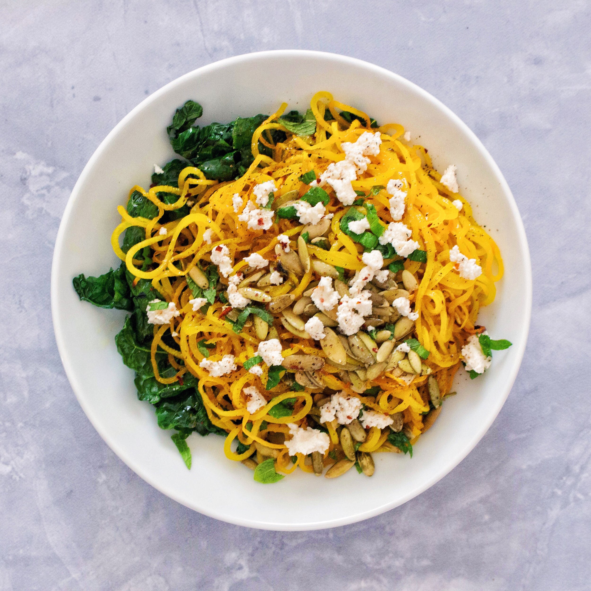 Spiralized Golden Beet Noodles with Mint, Pumpkin Seeds, and Ricotta
