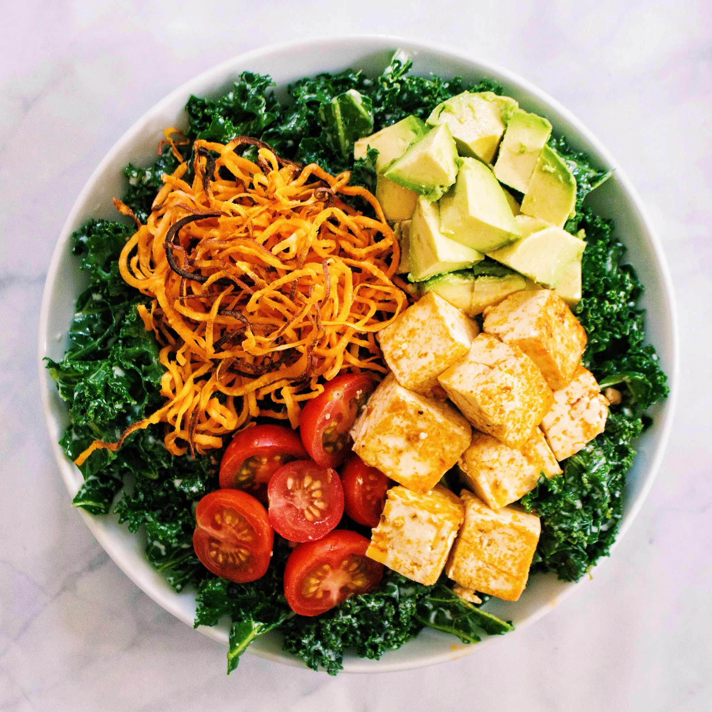 Creamy Kale Salad with Buffalo Tofu and Crispy Spiralized Sweet Potatoes