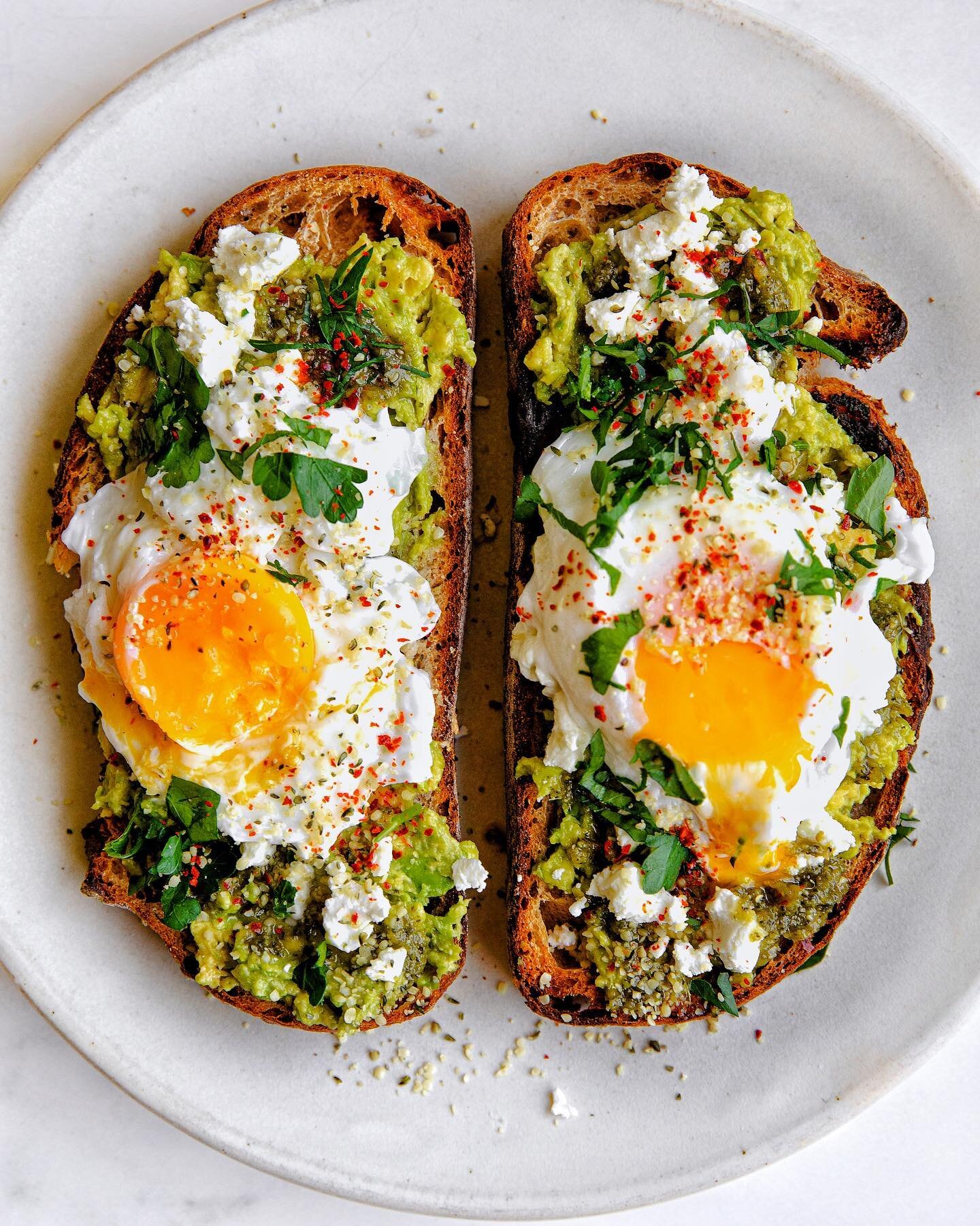 Goat Cheese &amp; Pesto Avo Toast with Poached Eggs &mdash; topped with parsley &amp; aleppo pepper and served on sourdough.

Poached Egg Tips!!!

1. Don&rsquo;t be afraid. It&rsquo;s easier than it seems, and even if your egg looks ugly going in, it