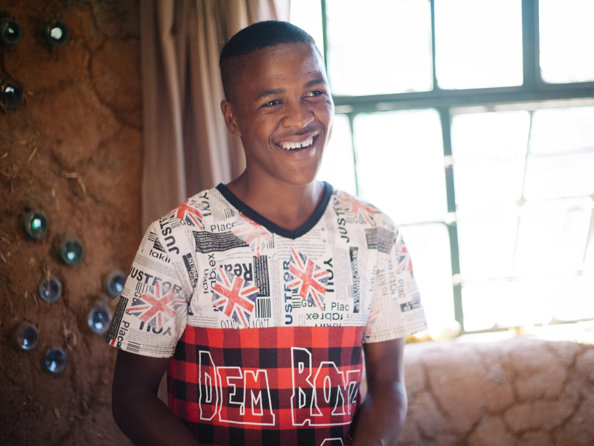 Gift, a student and member of Qala Phelang Tala, inside Mandel's house. 