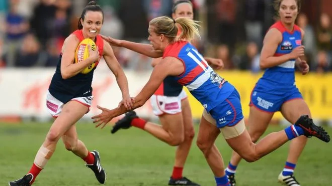 Women playing Australian Rules Football