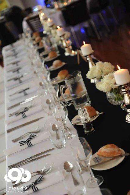 Bridal Table . silver candlesticks, navy + white, white roses in fishbowl vase