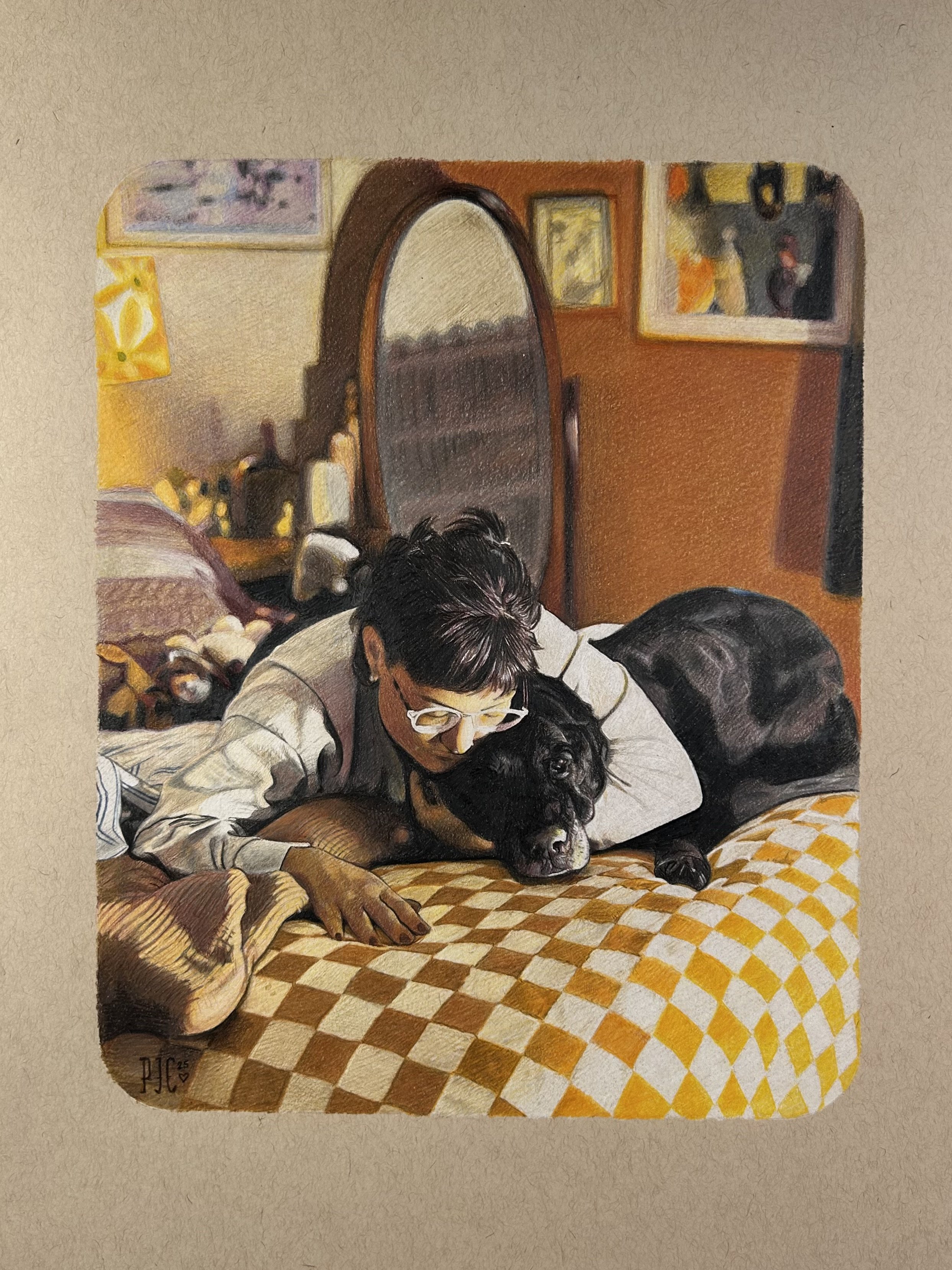 Person lying on a bed cuddling a black dog, with a mirror and artwork on the wall in the background.