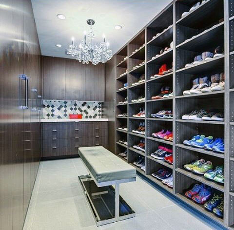 bachelor-pad-sneaker-closet-with-ceiling-chandelier.jpg