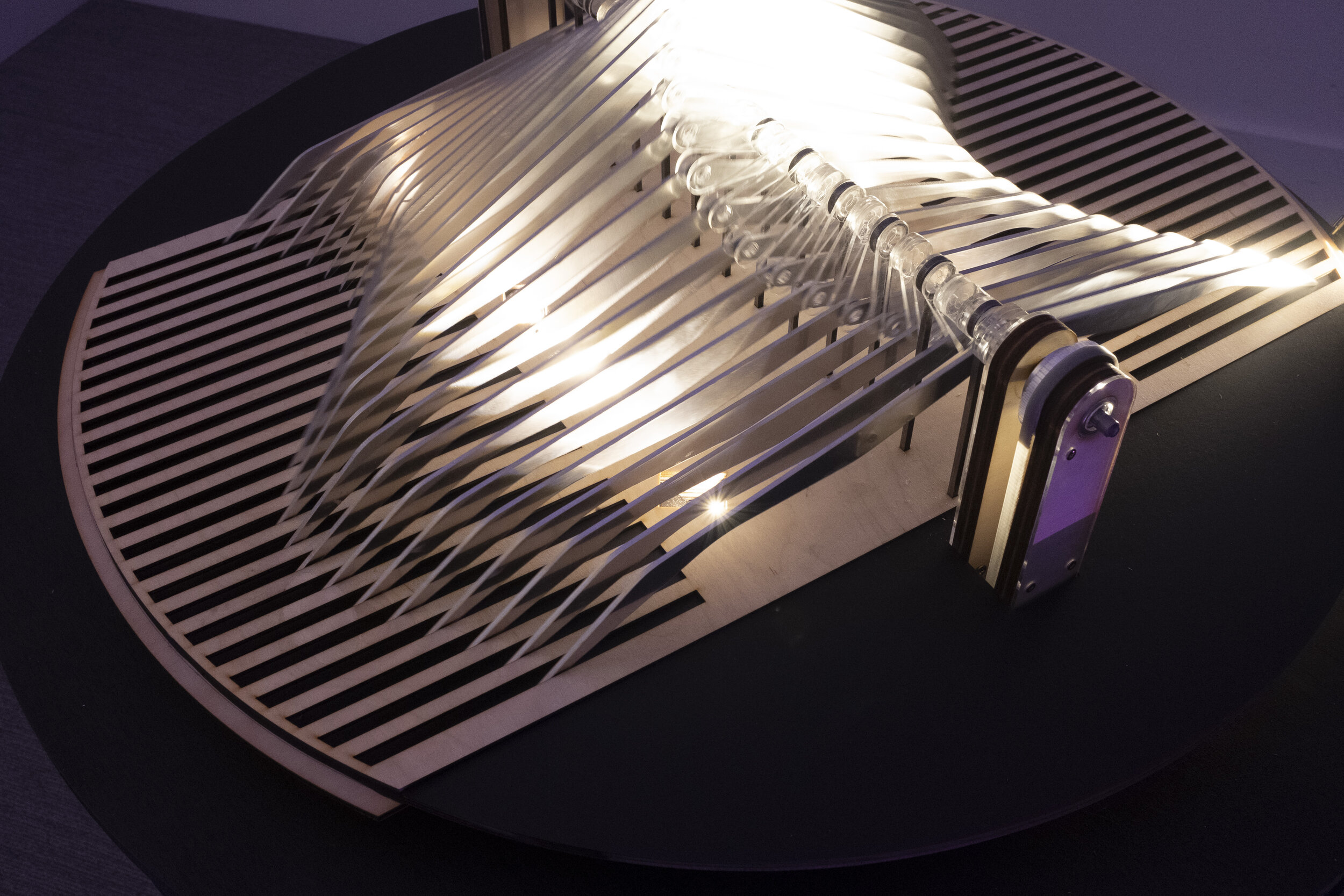  The mechanism is designed with an organic form that is rhythmically fluid when controlled at one control point for a chain of motion across the elemental units. An incremented angular system following the central axis allowed for this to be achieved