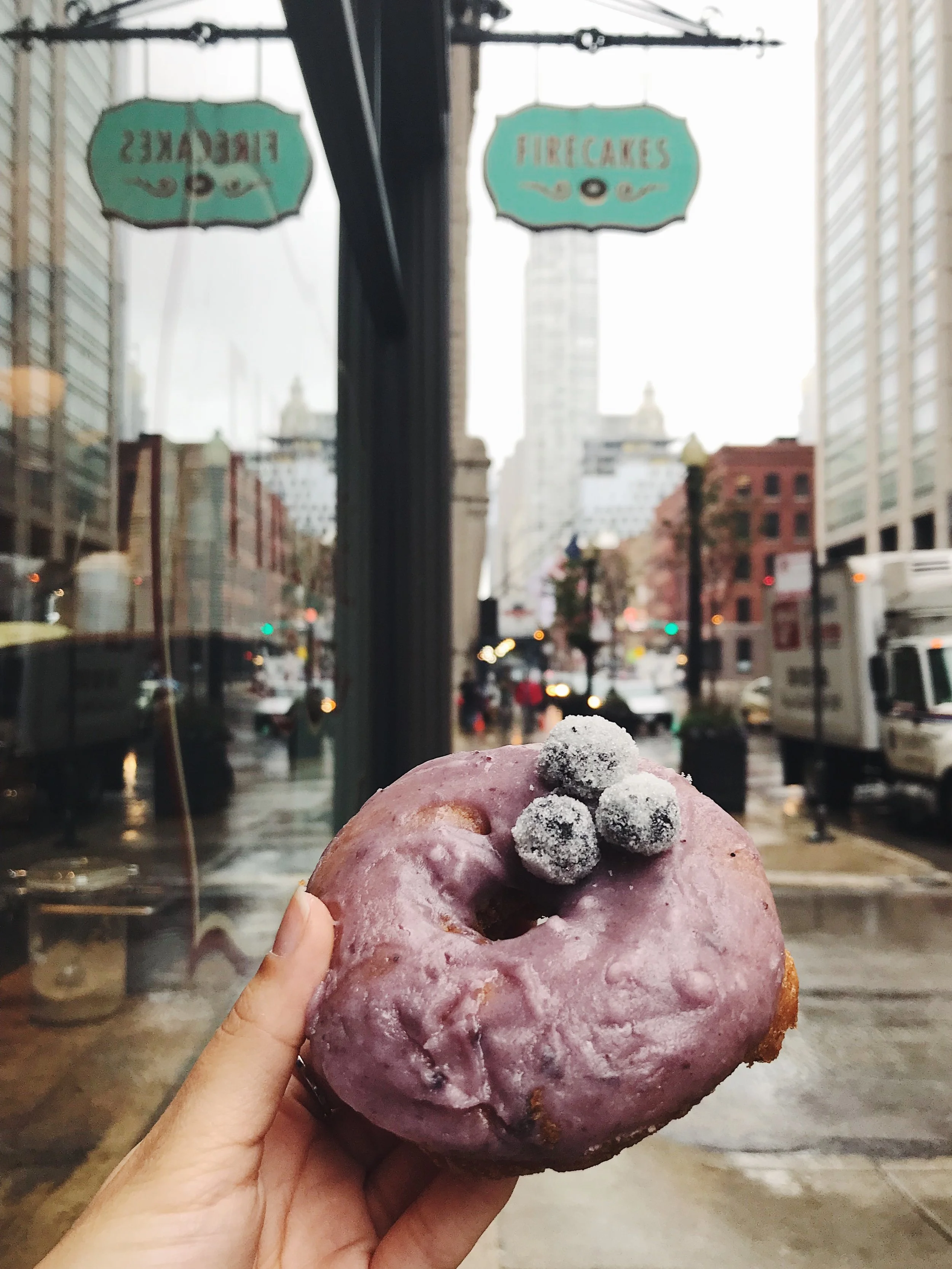 Firecakes - lemon blueberry donut Lemony cake donut with a super creamy blueberry glaze. They even roll the blueberries in sugar, which makes them like little candies on top.