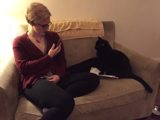 Miranda gives her adopter's paperwork one final look over before going home. 