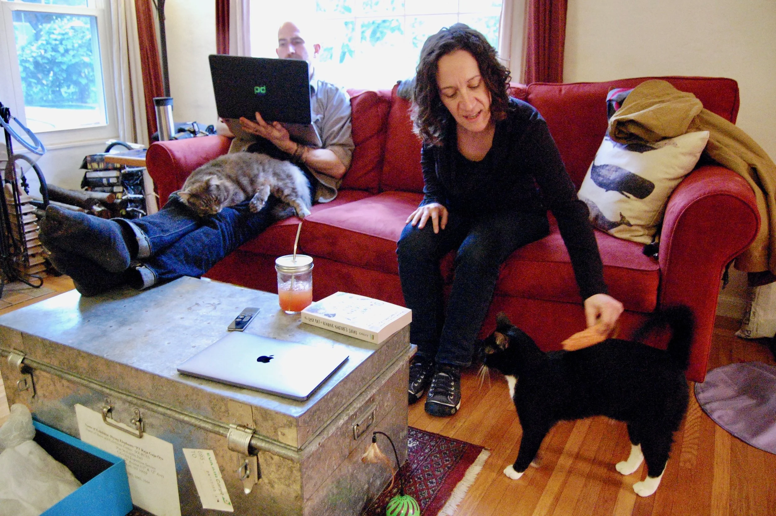 Jen and Puck enjoy some petting time, while Lowell relaxes with Matt.