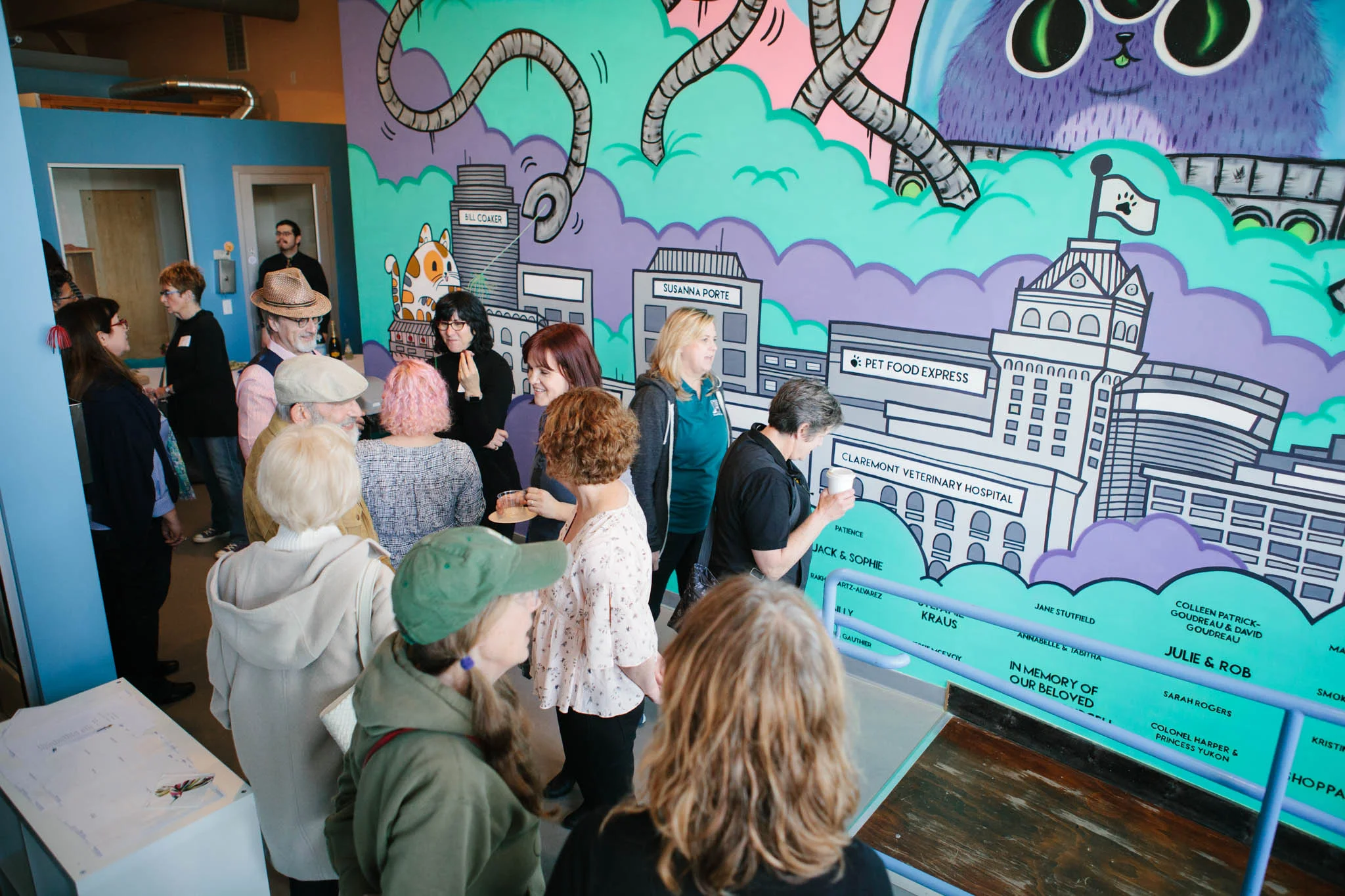 Donors gather for the mural reveal party at Cat Town on April 7th. Photo by Scott Russell.