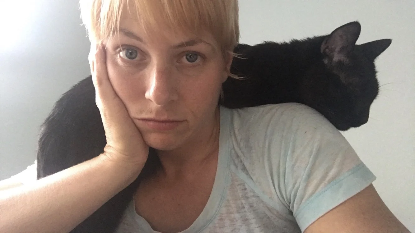 Kelda and her cat Herbie, a notorious lover of shoulder perching!