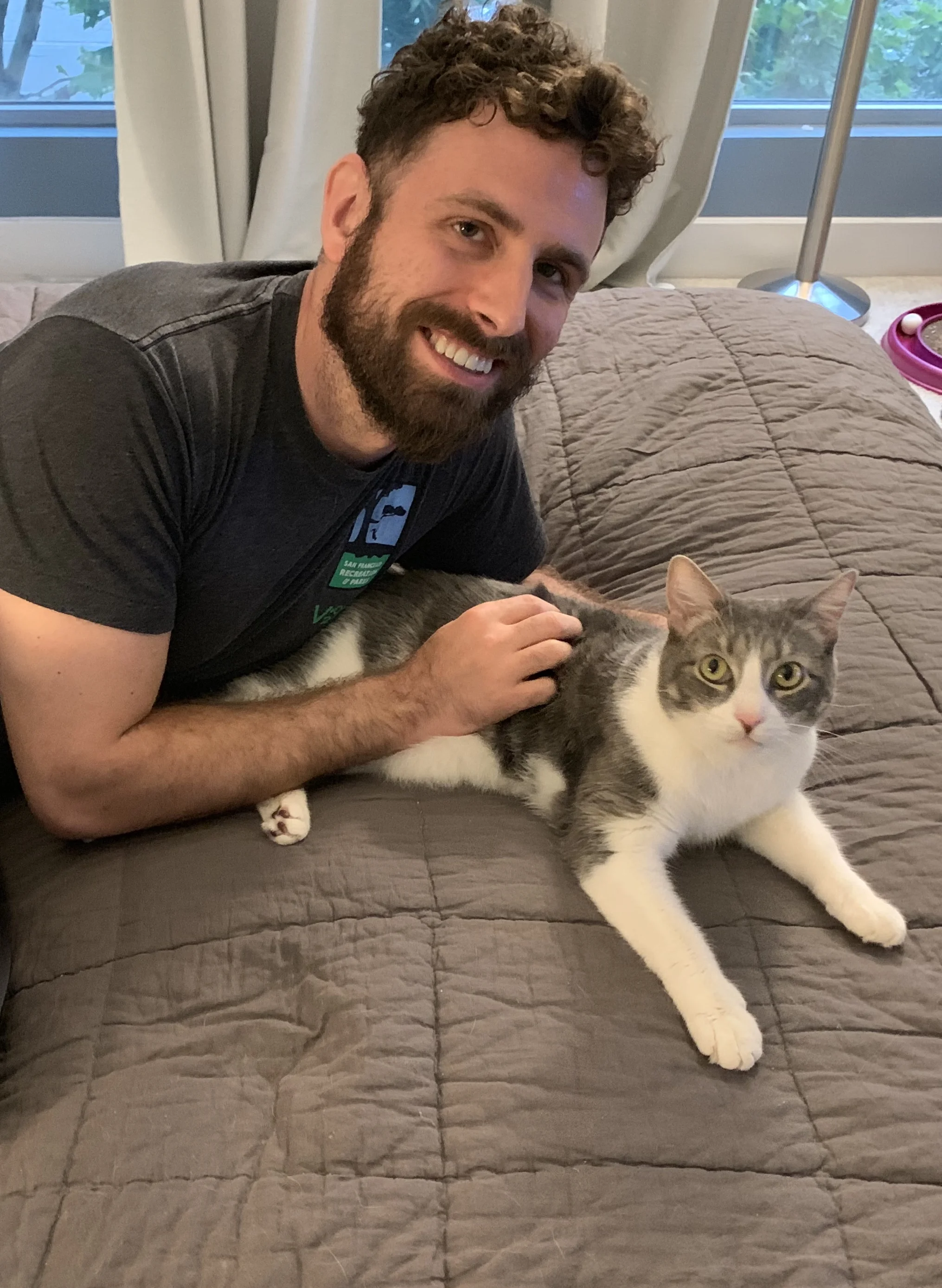 Cricket enjoys some cuddle time with Padrick.