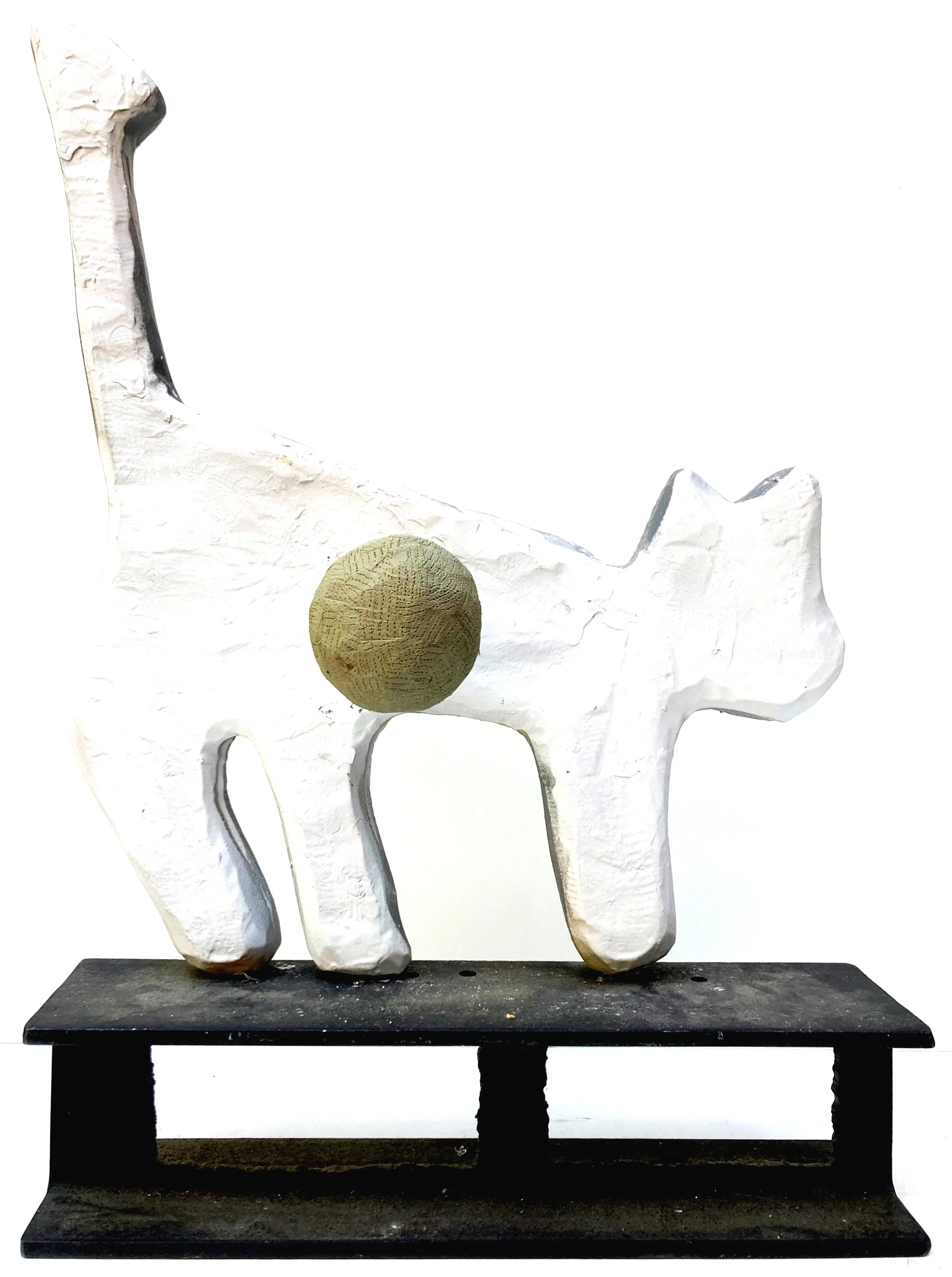 plastiline covered wood sphere with tooling marks