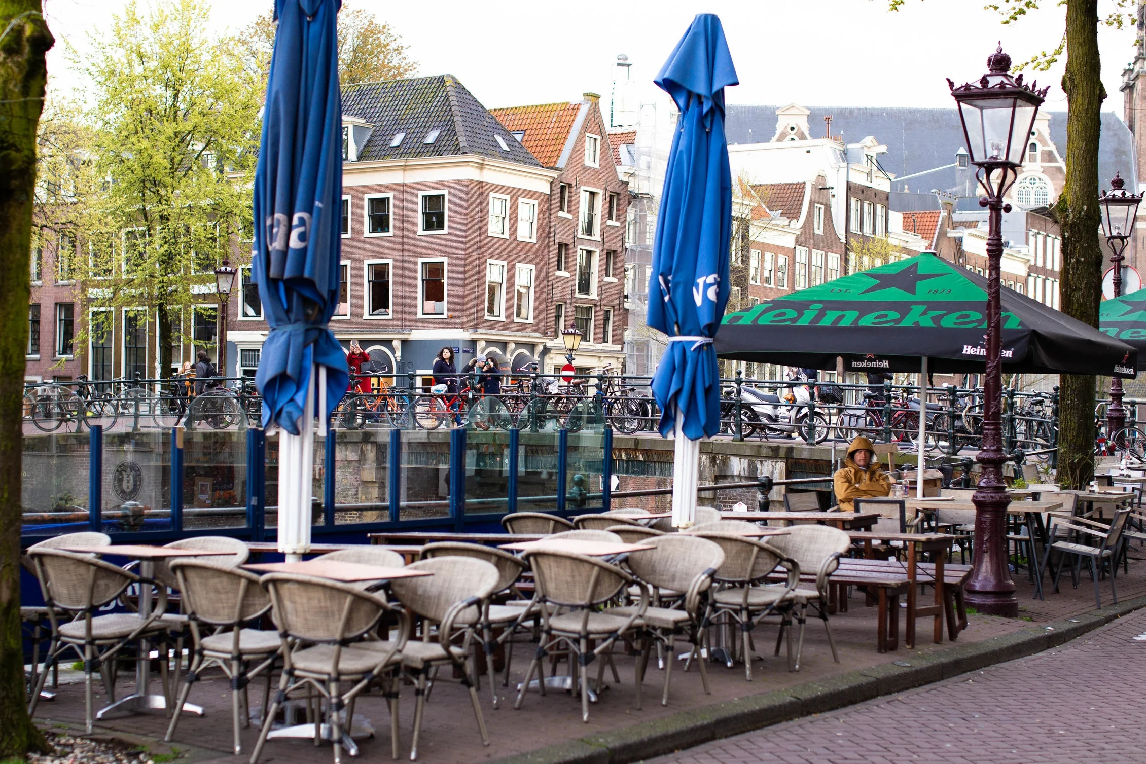 Man hiding out at a cafe with his raincoat