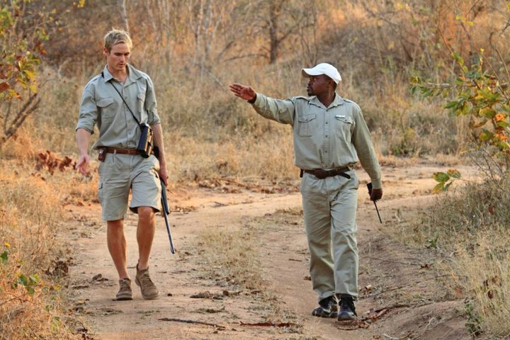 Hayman (left) with tracker and mentor Jack Sibuyi (right). Image by Josh Lustyan