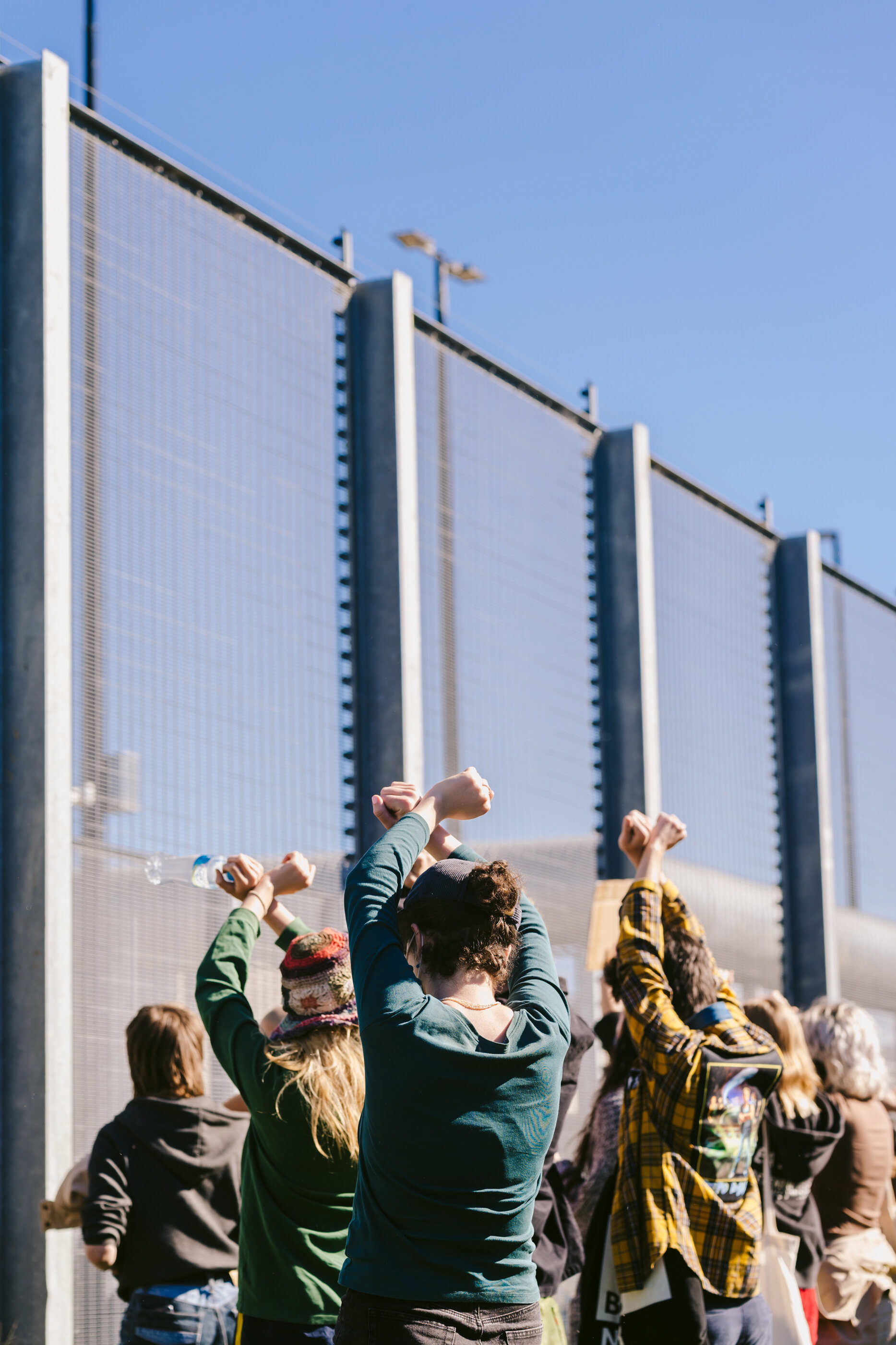  Protestors show solidarity with detainees outside the security fencing of Brisbane International Transit Accomodation (BITA)  