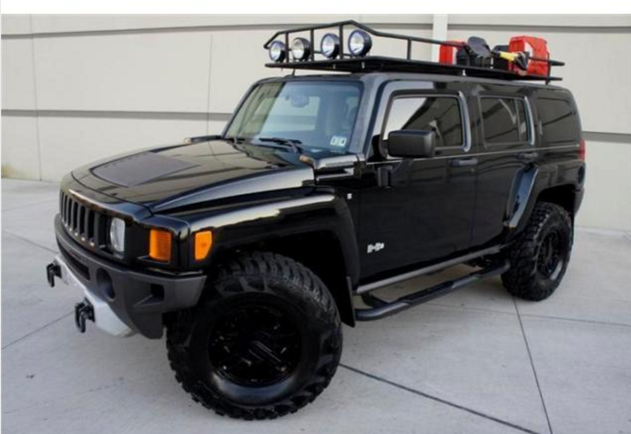 I really dig the clean look. there isn't a lot added here. The black painted plastics make an impact, mine have the grayish sun fade and tired of dumping the dress up goo to make them look better. Yes there is a monster roof rack, I have a garage height issue so that will be minimal. Factory wheels powdercoated keep the cost down and yes, I can fit those 35" tires under with a simple turn of the torsion key to level the front.