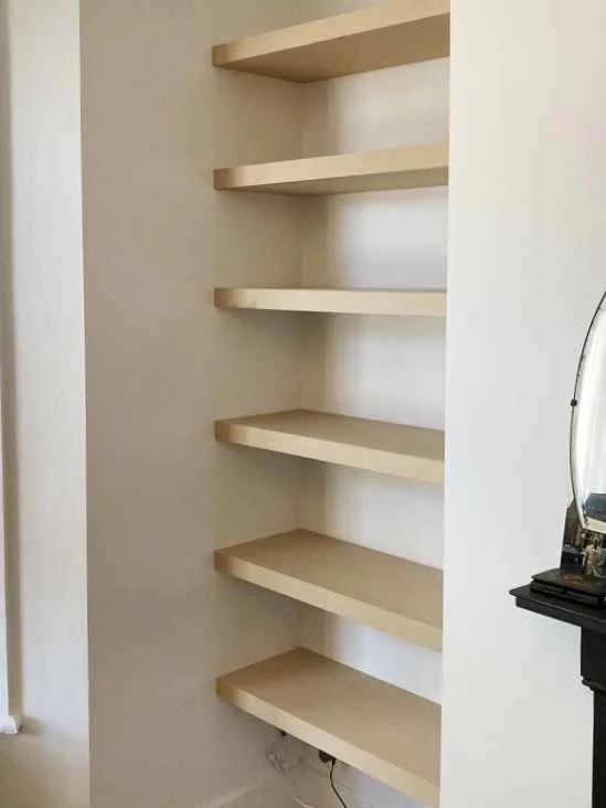 unpainted floating alcove shelves