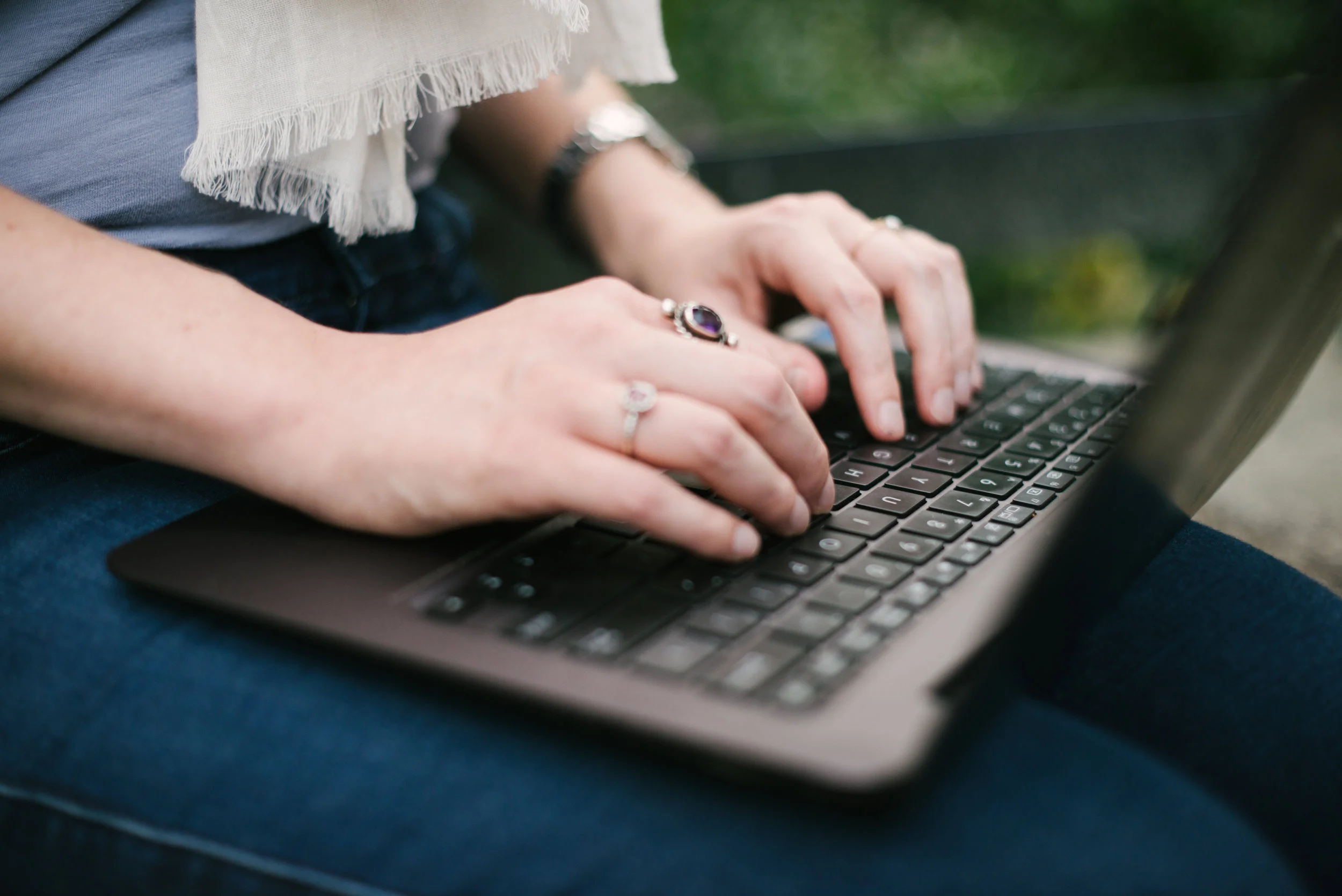 kaboompics.com_Female hand with rings on a notebook.jpg