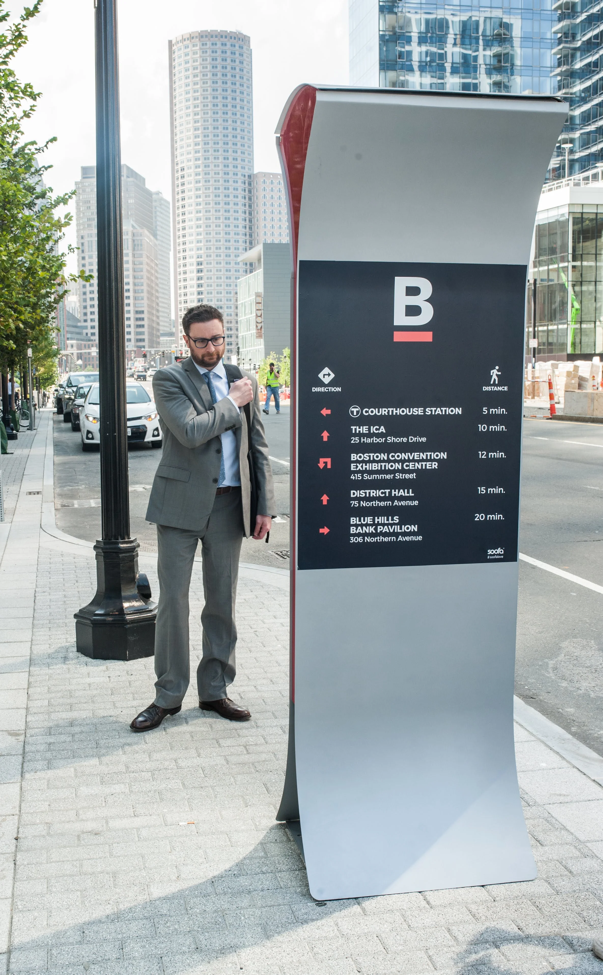 Custom wayfinding wraps on the back of Soofa Signs help you get where you need to go