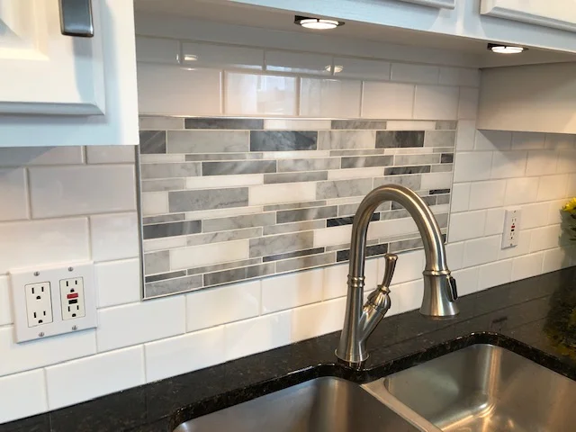 Beautiful brushed metal boarder framing in this marble detail.