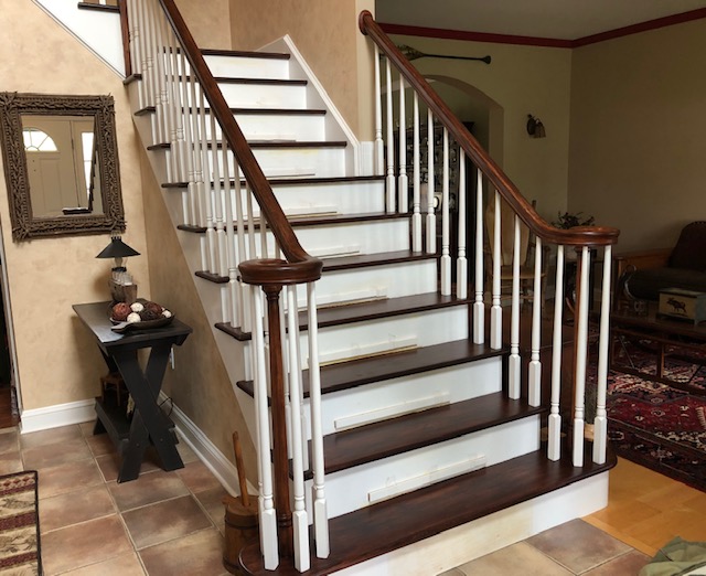 Re-stained staircase to match the new floors.