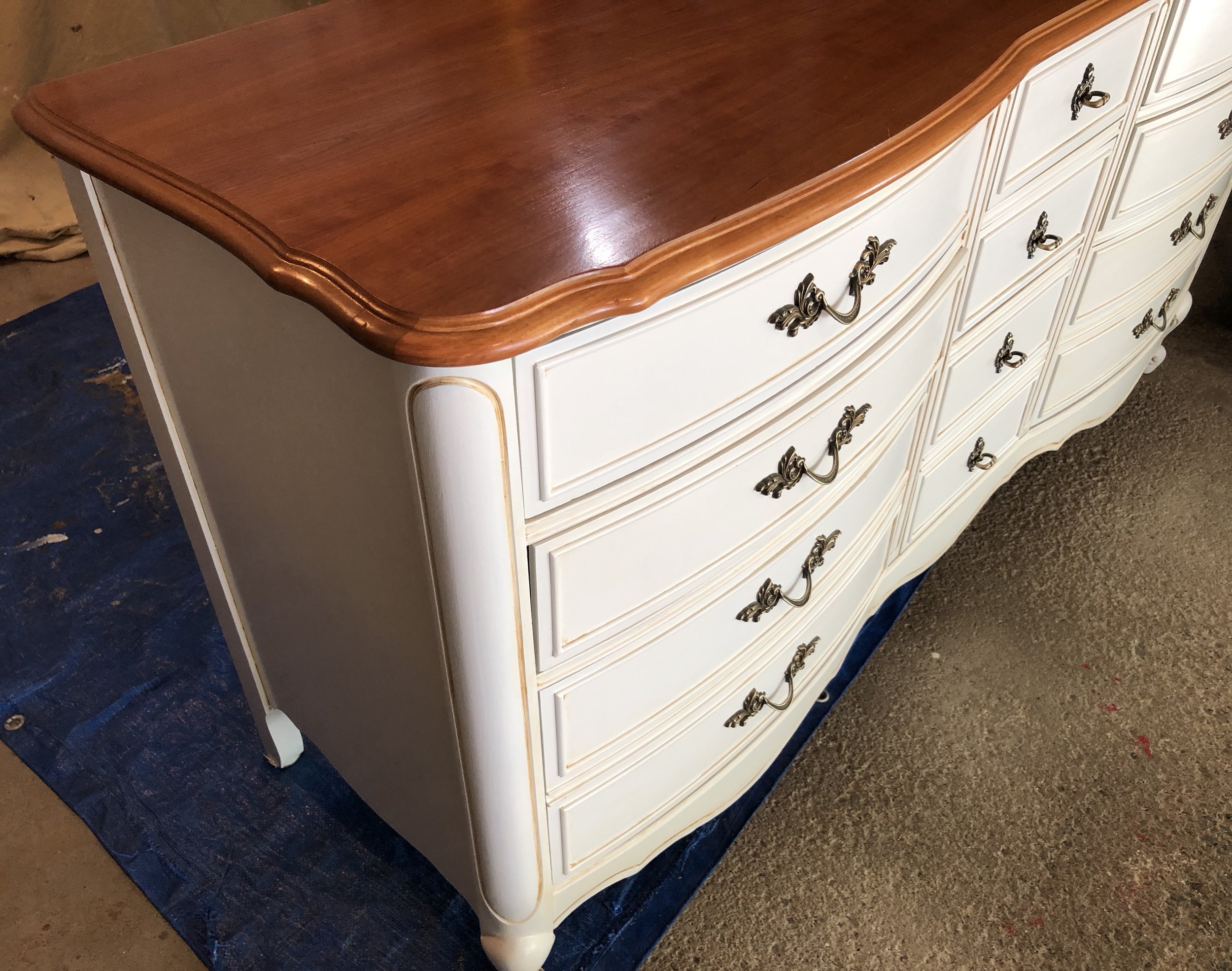 Top refinished and base painted with custom glazing technique that shows off the beautiful detailing on this vintage bedroom furniture.