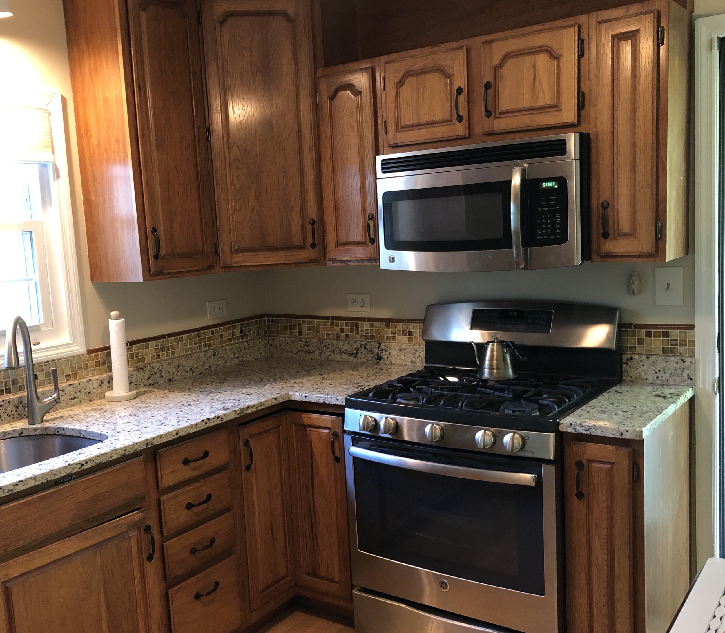 This Delmar homeowner was elated with her painted cabinets.