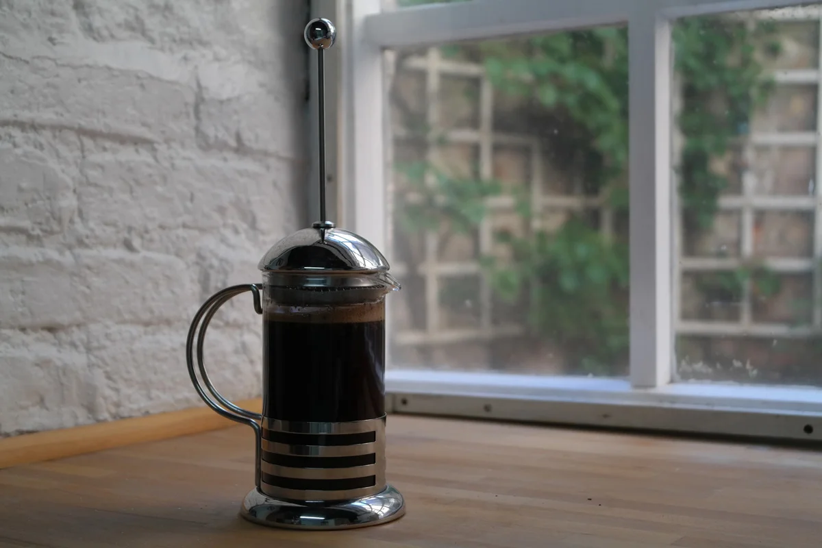 At this point you have 3 options. 1: you push the plunger down. 2: you give the coffee another stir and then push. 3: you scoop the coffee grounds from the top of the pot and then push down.