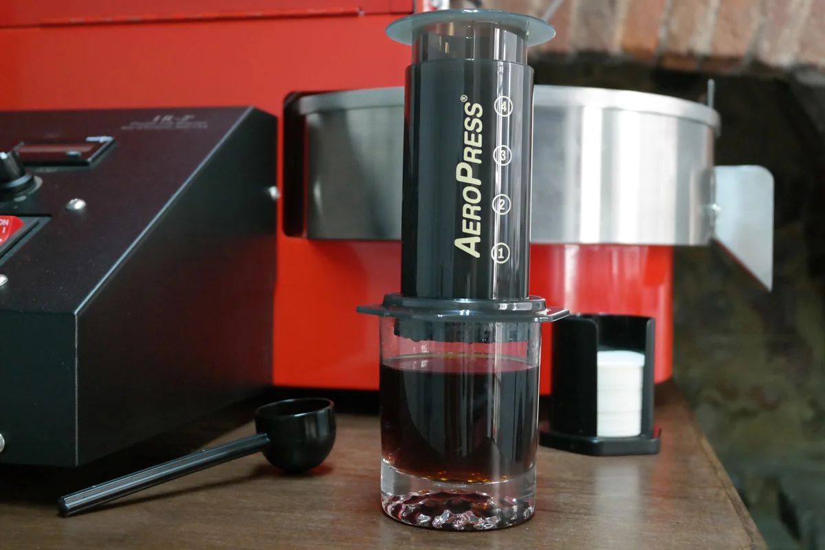 Once all the water has been pushed through, take the Aeropress off the glass/cup. Empty the filter cap, and rinse clean all parts. The filter paper can be reused if you wish. Dry all parts, and leave the plunger within the chamber.
