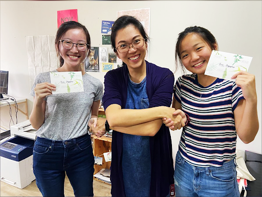 Lily (left) and Charmain (right) being congratulated the ‘Huijia way’