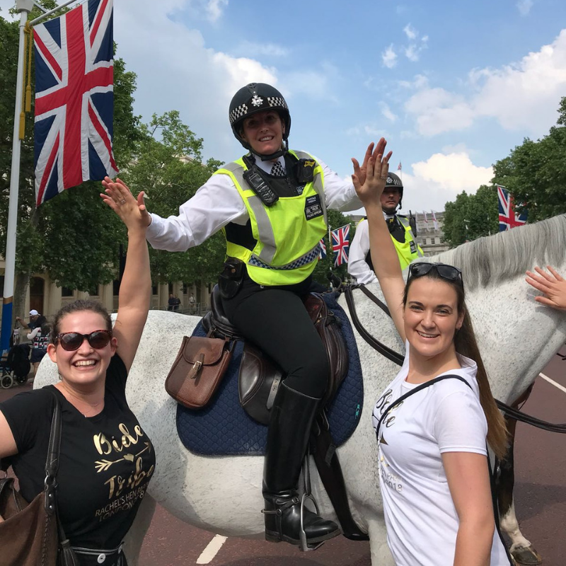 2 team members high fiving a policeman