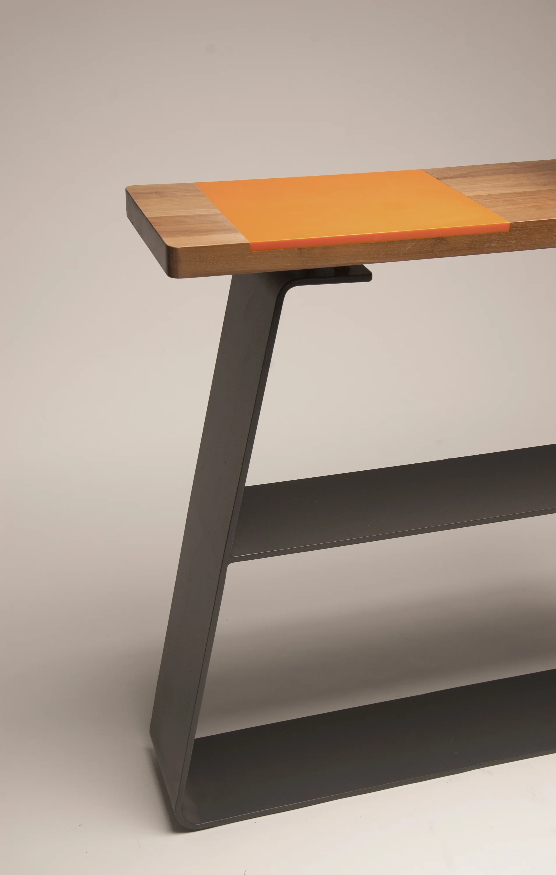 Låda Console Table The låda range is inspired by pre rolled stock such as box section. The use of mix materials creates a conversation due to the contrast it creates in colour and texture. The simple clean geometric shapes allow for the materials to be the most important part of this range. The console table is perfect for displaying items and adding a touch of contemporary aesthetic to the home.