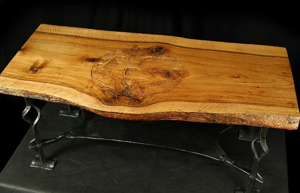 The base is hammered and shaped forged steel made by renowned western MD metalsmith Tim Beachley. Tim used a rarely seen key-joint technique to attach the lower shelf along with attractive open twists on each legs. A patina was added t