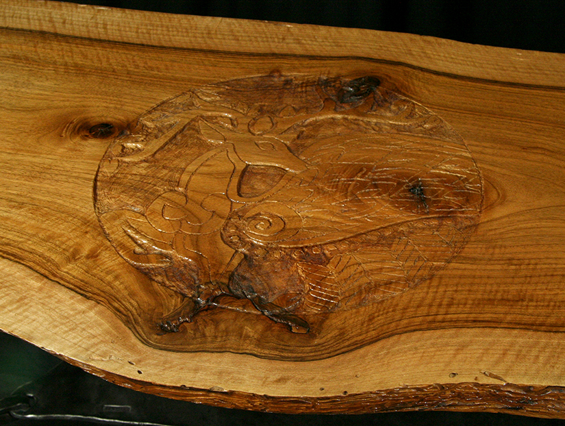 English walnut slab table with carving