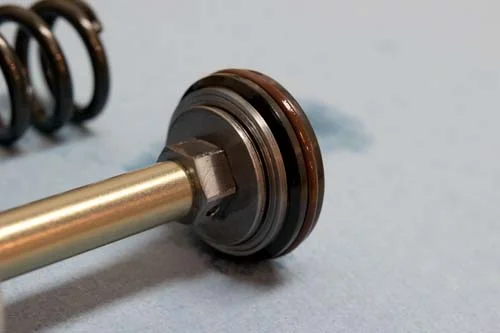 The base valve has a thick stack of .10 shims.