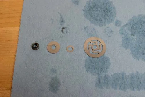 This unique base valve refill check system does away with the standard check spring. The shim with the sculpted interior flexes freely enough to function as a check valve all by itself.