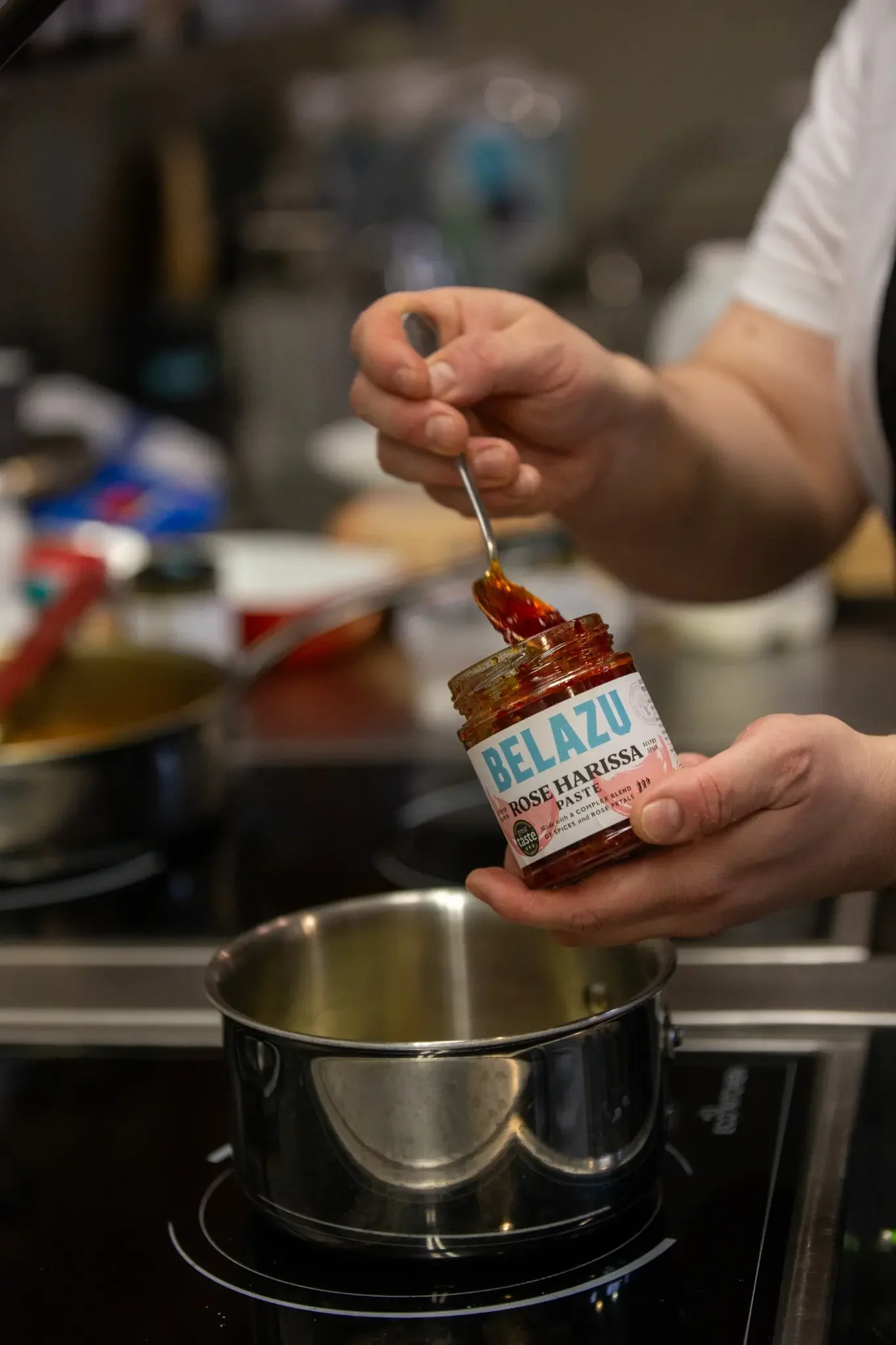 belazu-rose-harissa-cooking.webp