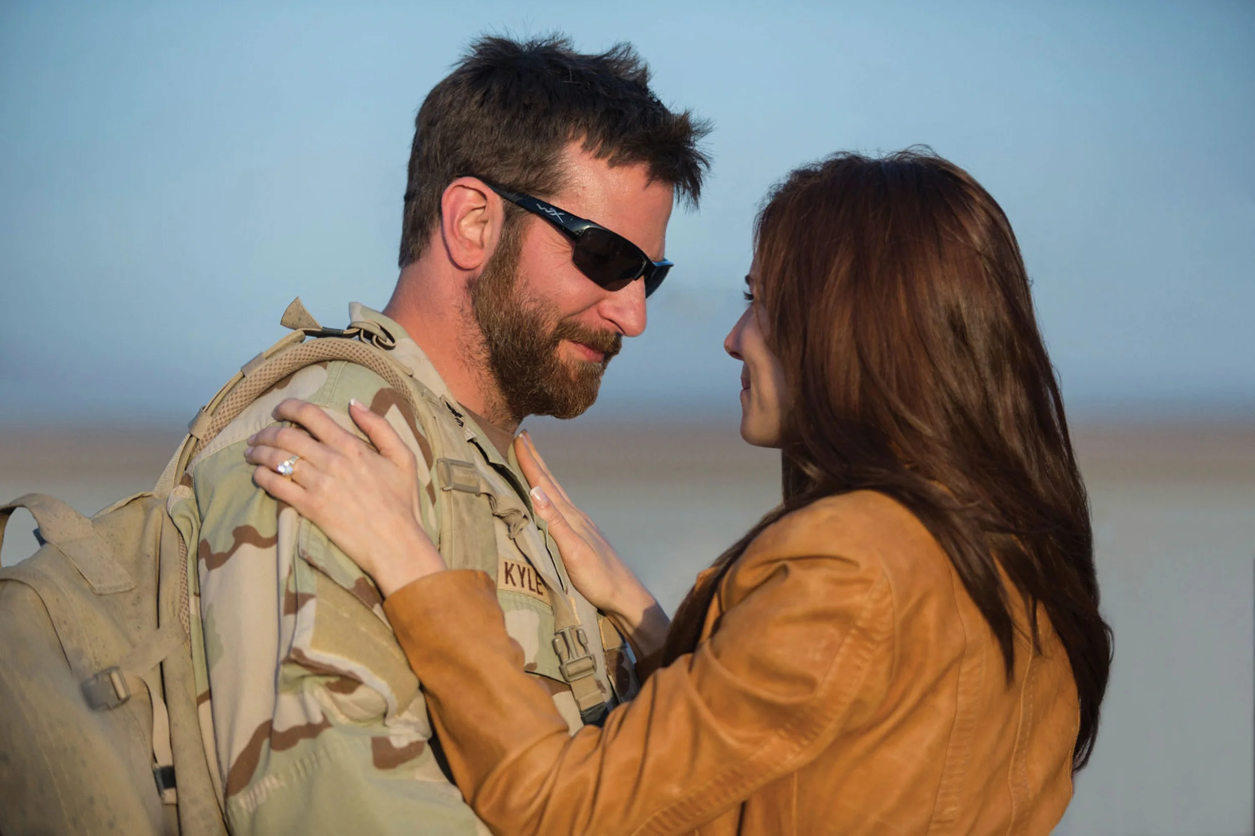 Chris Kyle (Bradley Cooper) and wife Taya (Sienna Miller), his steadfast if not always happy home front support system.