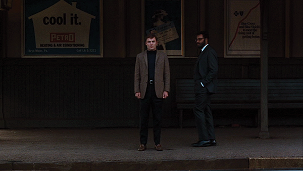 Stacy Keach as the catatonic Jacob Horner meeting James Earl Jones as Dr. D at the train station