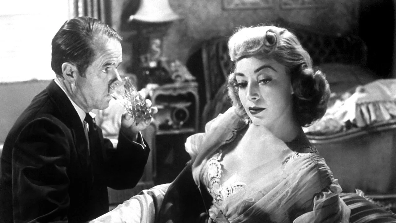George Peaty (Elisha Cook, Jr.) with his wife, Sherry Peaty (Marie Windsor)