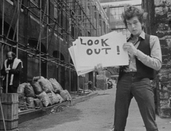 Bob Dylan, with Allen Ginsberg in the background, from Don't Look Back 's famous opening