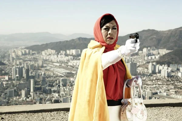 Michael Shaowanasai as Iron Pussy in The Adventure of Iron Pussy