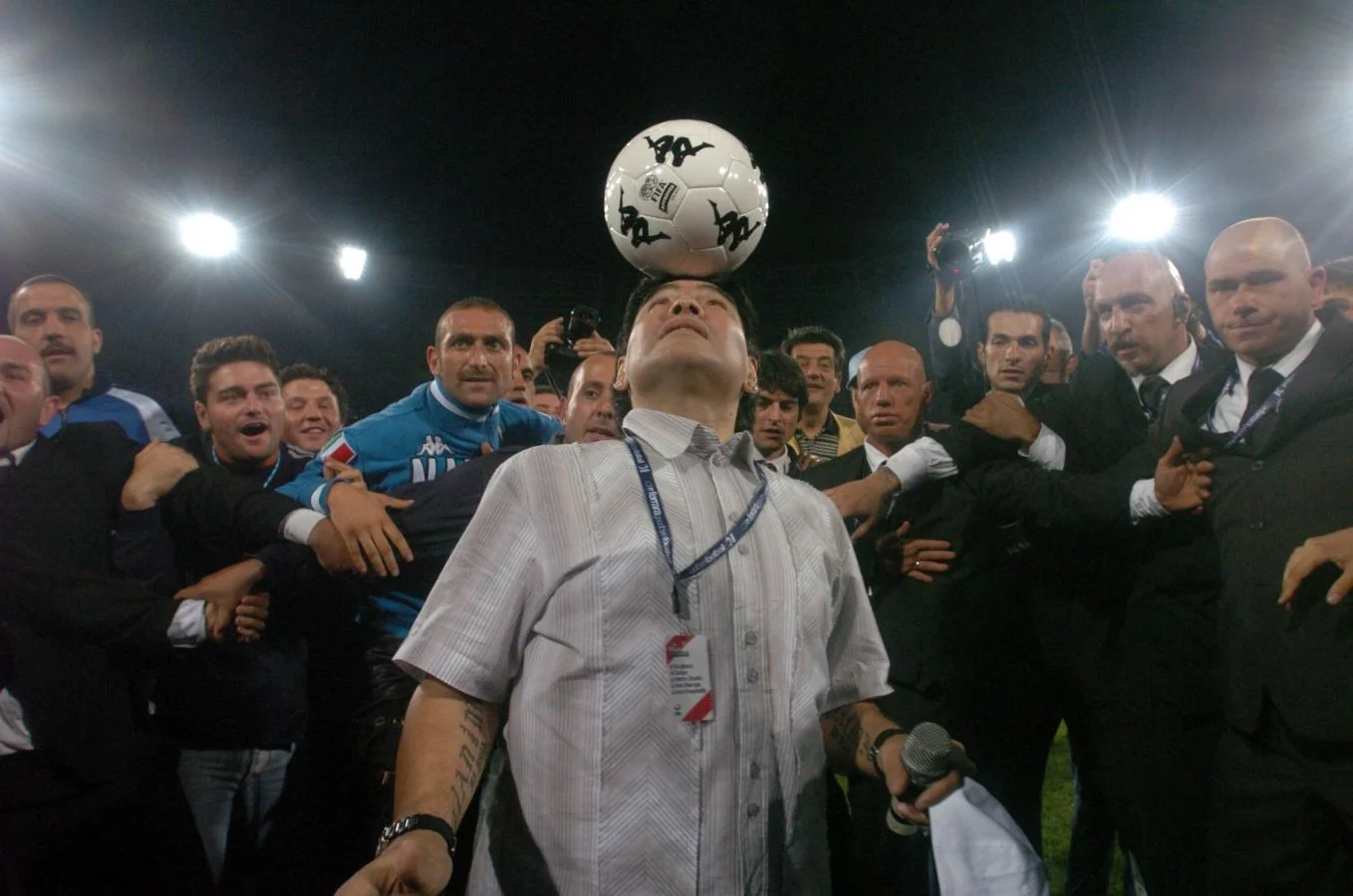 Soccer great Diego Maradona playing up to the Press in Emir Kusturica's Maradona by Kusturica